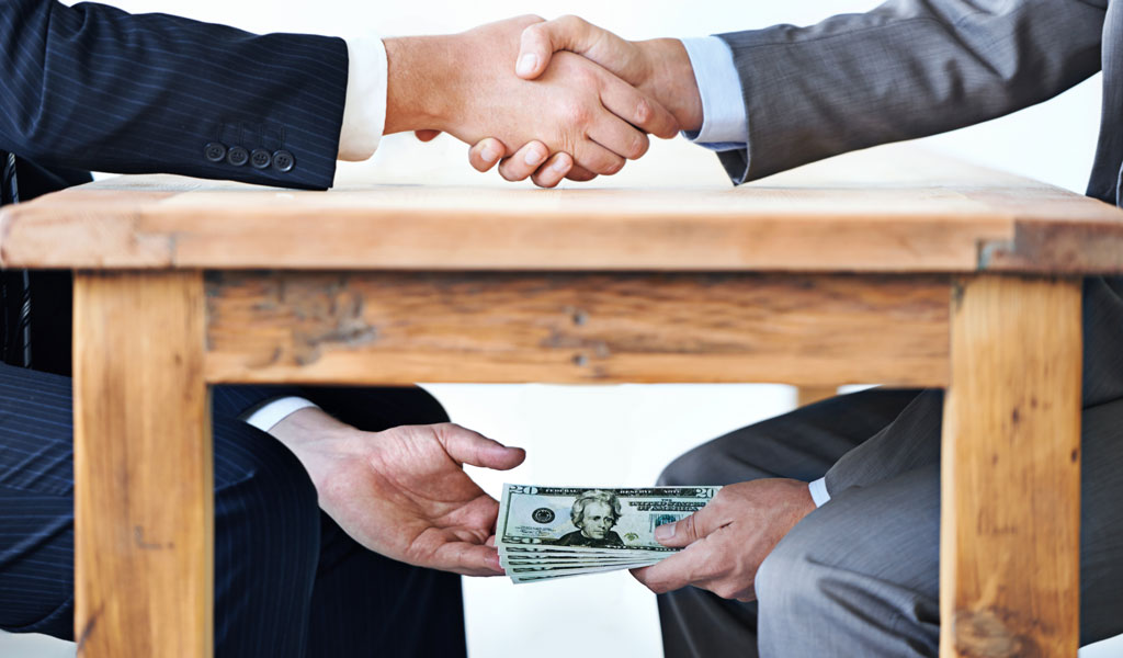 BLOG-1024x600-money-under-the-table-PeopleImages-iStock-477514725